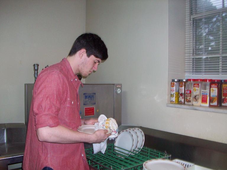 A future Athens Campus Club member drying dishes